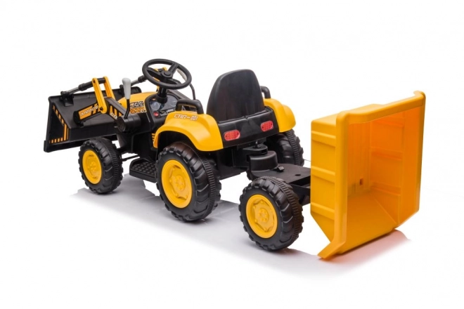 Elektrický traktor s lžící žlutý