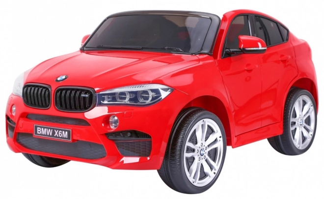 BMW X6M XXL pro 2 děti Červená + dálkové ovládání + eko kůže + bezpečnostní pásy + pomalý rozjezd + MP3 USB + LED dioda