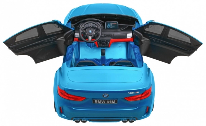 BMW X6M XXL pro 2 děti Modrá barva + Pilot + Eco kůže + Bezpečnostní pásy + Pomalý start + MP3 + LED