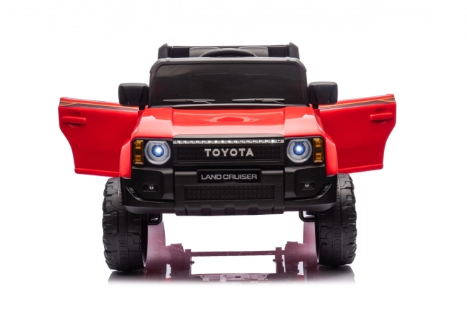 Czerwony pojazd Toyota Land Cruiser Prado