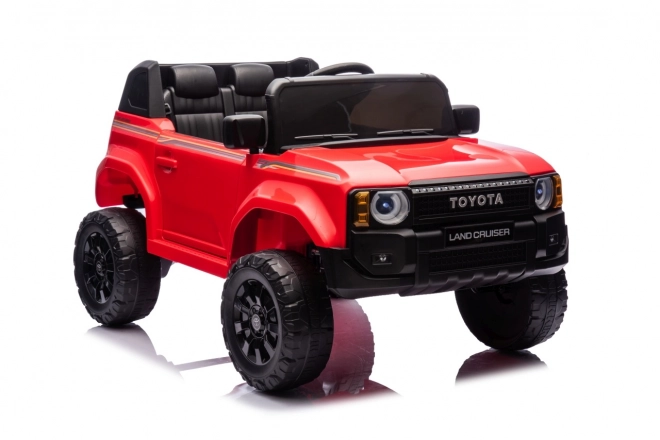 Czerwony pojazd Toyota Land Cruiser Prado