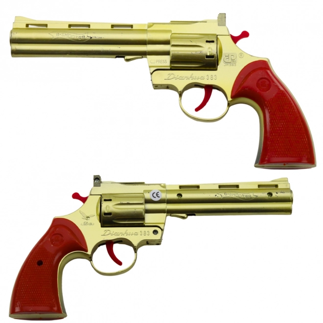 Zlatý revolver na kapsle s efektem zvuku výstřelu