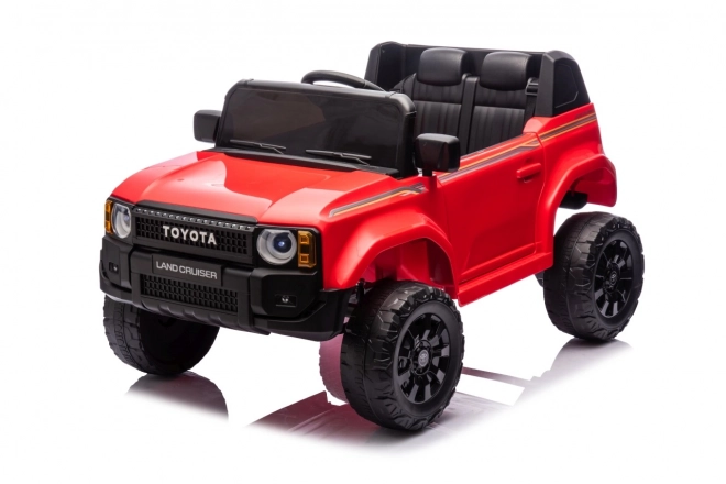 Czerwony pojazd Toyota Land Cruiser Prado