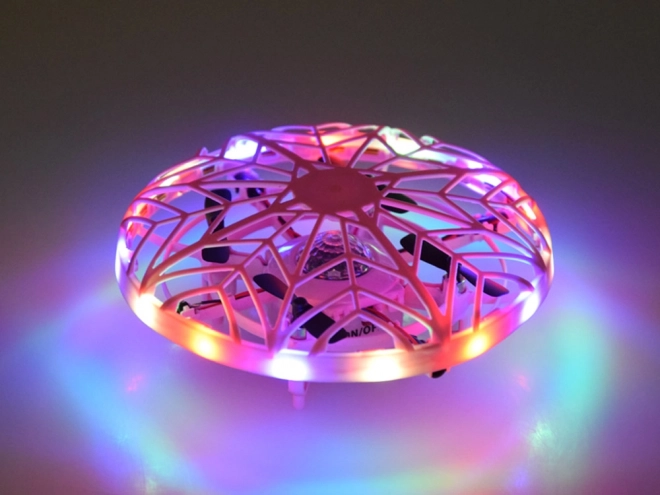 Létající disk s LED světlem ovládaný rukou