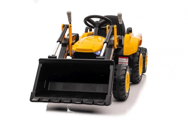 Elektrický traktor s lžící žlutý