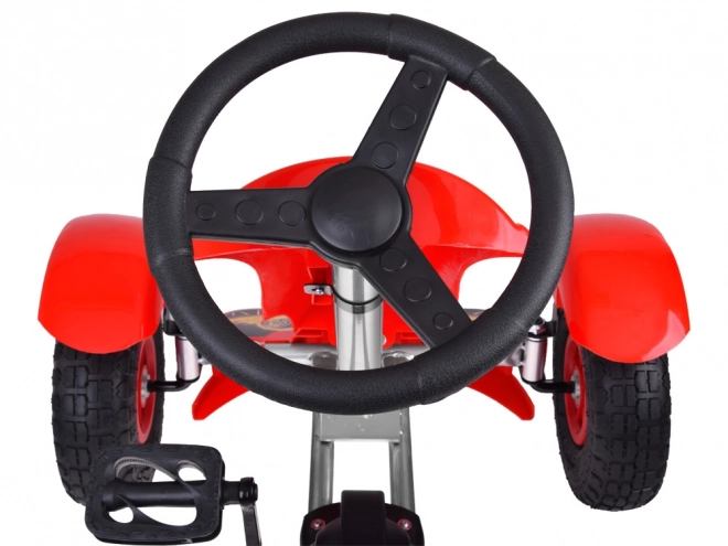Sportovní zelený šlapací motokára s nafukovacími koly