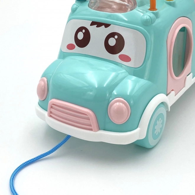 Woopie muzicírovací auto se zeleným sorterem a xylofonem