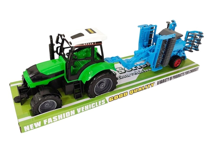 Dětský traktor s přídavným zemědělským strojem