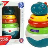 chrastítko dinosaurus s barevnými kroužky a kolébající základnou