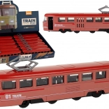 Červený kovový vlak na třecí pohon se zvuky